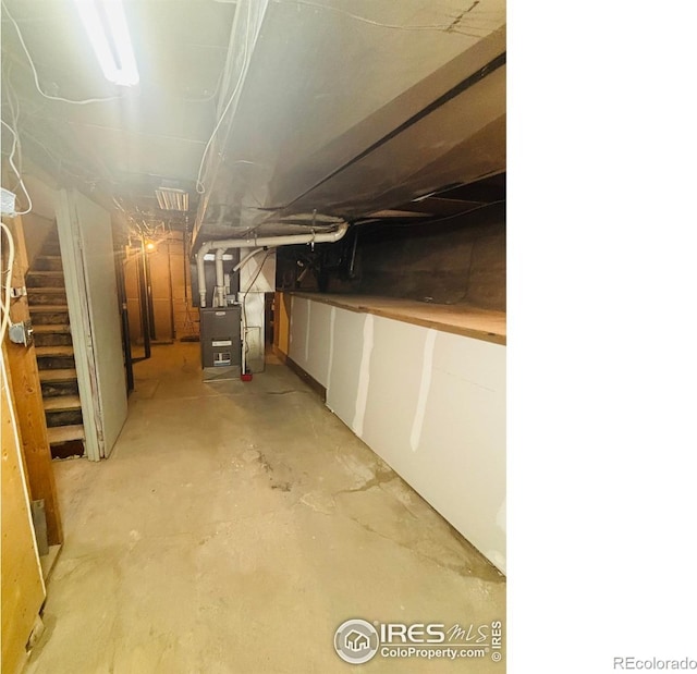 151 W 1st St N, Cheyenne Wells, CO 80810 - unfinished basement featuring stairs and heating unit