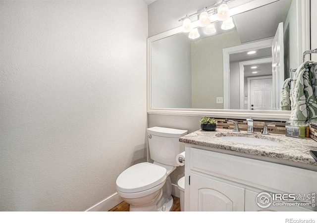 4615 Kitchell Way, Fort Collins, CO 80524 - half bath with vanity, recessed lighting, and wood finished floors
