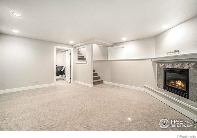 4615 Kitchell Way, Fort Collins, CO 80524 - finished below grade area featuring stairs, recessed lighting, carpet floors, and a tile fireplace