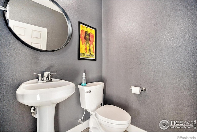 4615 Kitchell Way, Fort Collins, CO 80524 - half bath with toilet and a textured wall