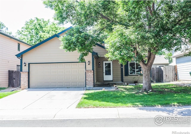425 Walden Way, Fort Collins, CO 80526 - view of front of house featuring brick siding, concrete driveway, and an attached garage