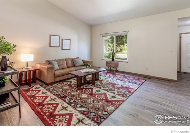 425 Walden Way, Fort Collins, CO 80526 - living room with lofted ceiling and wood finished floors