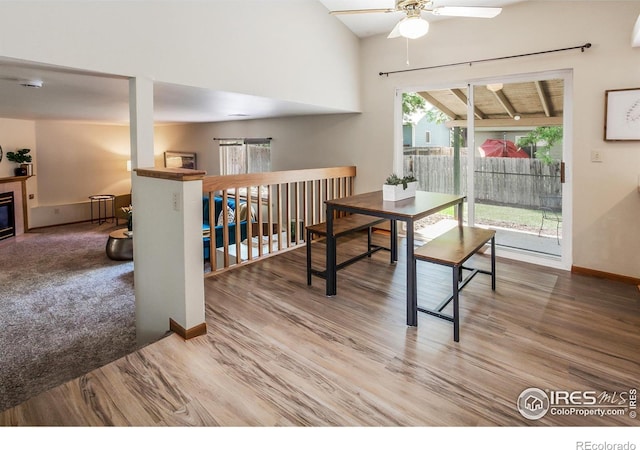 425 Walden Way, Fort Collins, CO 80526 - dining area featuring ceiling fan, wood finished floors, and a glass covered fireplace