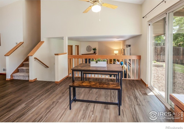 425 Walden Way, Fort Collins, CO 80526 - dining room featuring wood finished floors, a ceiling fan, and a high ceiling