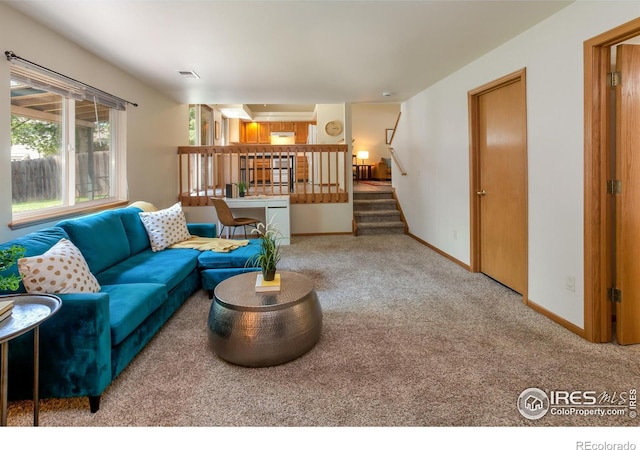 425 Walden Way, Fort Collins, CO 80526 - carpeted living area with baseboards and stairs