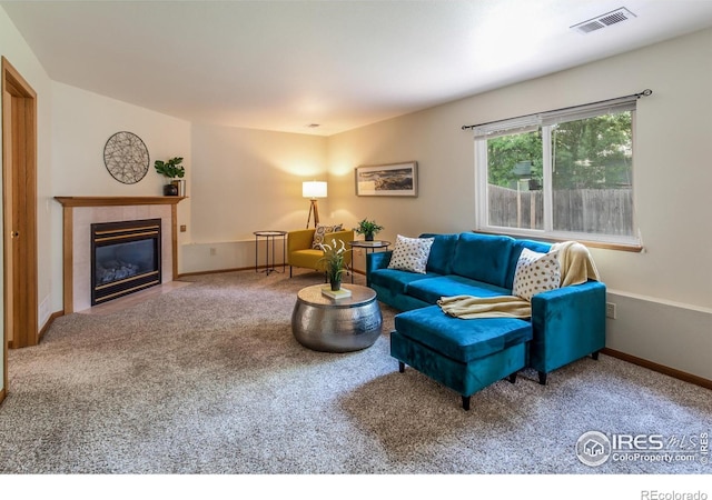 425 Walden Way, Fort Collins, CO 80526 - carpeted living room with a tile fireplace and baseboards