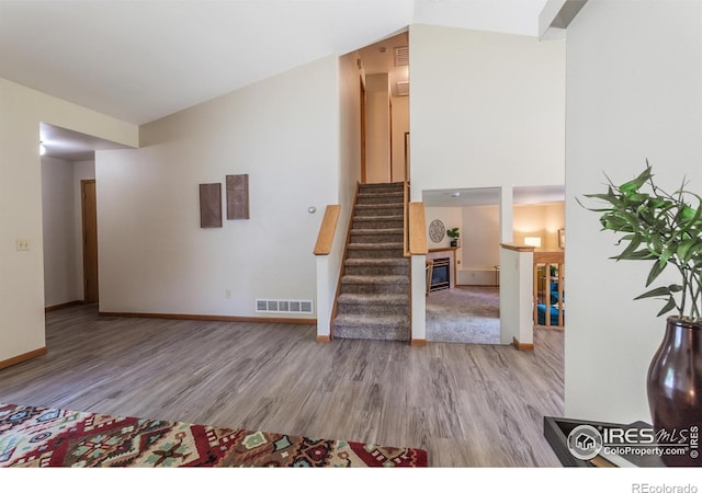 425 Walden Way, Fort Collins, CO 80526 - staircase featuring wood finished floors and a towering ceiling