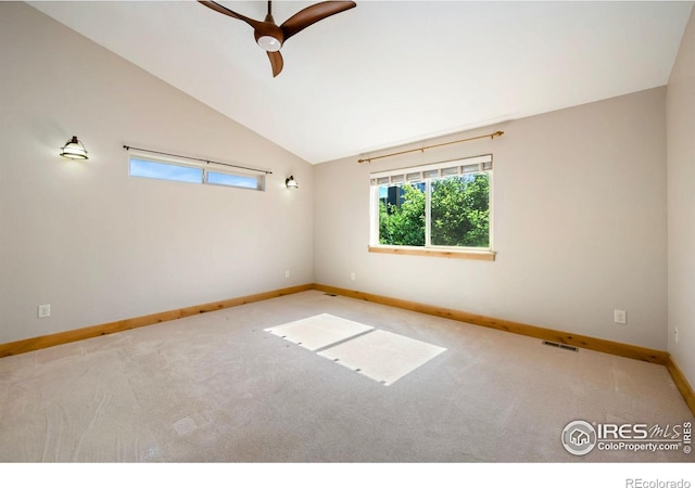 333 Braveheart Ln, Johnstown, CO 80534 - spare room featuring vaulted ceiling, carpet floors, and a ceiling fan