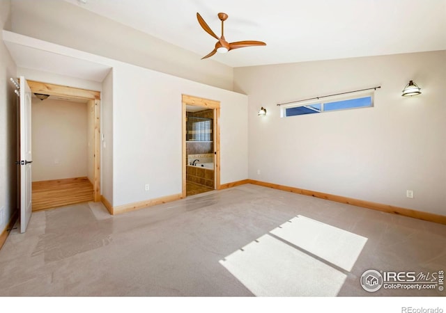 333 Braveheart Ln, Johnstown, CO 80534 - unfurnished bedroom with carpet flooring, vaulted ceiling, and ensuite bathroom