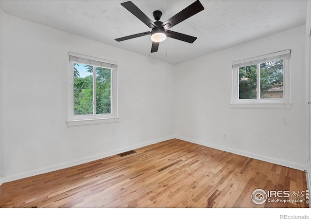 6755 W 33rd Ave, Wheat Ridge, CO 80033 - unfurnished room featuring light wood-type flooring and a ceiling fan