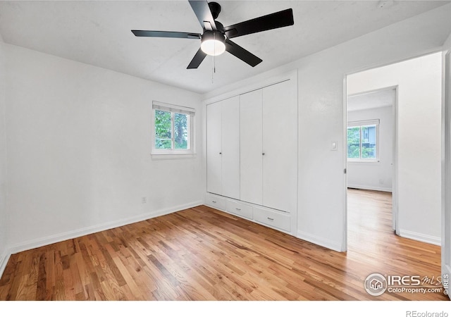 6755 W 33rd Ave, Wheat Ridge, CO 80033 - unfurnished bedroom featuring light wood finished floors, a closet, and a ceiling fan