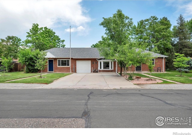 6755 W 33rd Ave, Wheat Ridge, CO 80033 - ranch-style home featuring an attached garage, a front yard, driveway, and brick siding