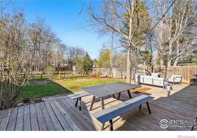 6755 W 33rd Ave, Wheat Ridge, CO 80033 - wooden terrace with outdoor dining space and a fenced backyard