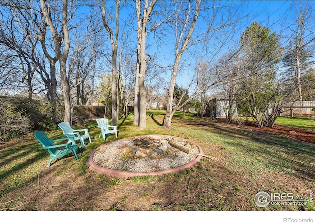 6755 W 33rd Ave, Wheat Ridge, CO 80033 - view of grassy yard featuring an outdoor fire pit