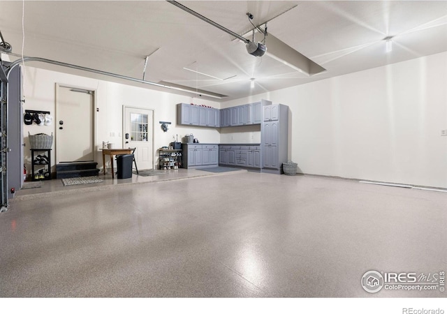 3000 E Cedar Ave Unit 2, Denver, CO 80209 - garage featuring a garage door opener