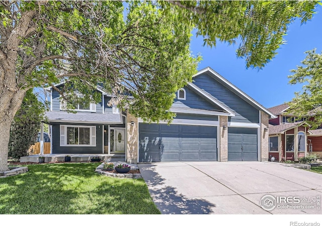 5491 E 117th Ave, Thornton, CO 80233 - view of front facade with an attached garage, concrete driveway, a front lawn, and brick siding