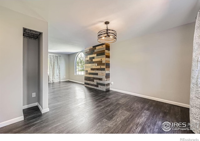 5491 E 117th Ave, Thornton, CO 80233 - unfurnished living room featuring dark wood finished floors and a chandelier