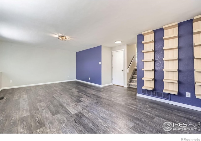5491 E 117th Ave, Thornton, CO 80233 - spare room with dark wood-type flooring and stairway