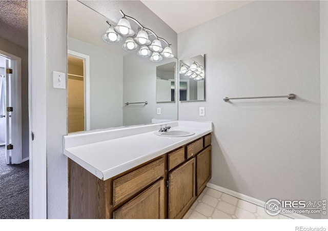 5491 E 117th Ave, Thornton, CO 80233 - bathroom with vanity and baseboards