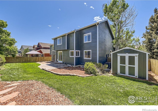 5491 E 117th Ave, Thornton, CO 80233 - rear view of house featuring a storage shed and a patio area