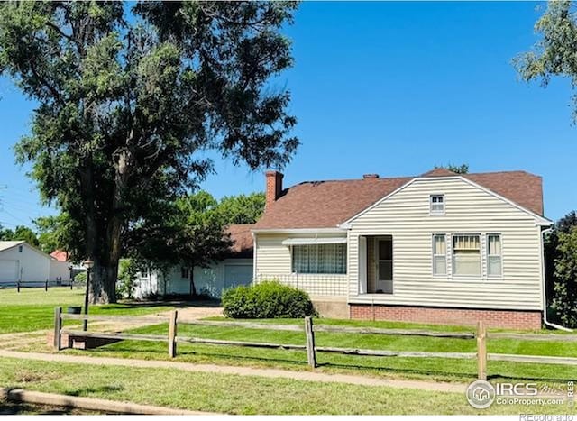 141 N Walker Ave, Haxtun, CO 80731 - view of front of home featuring a chimney