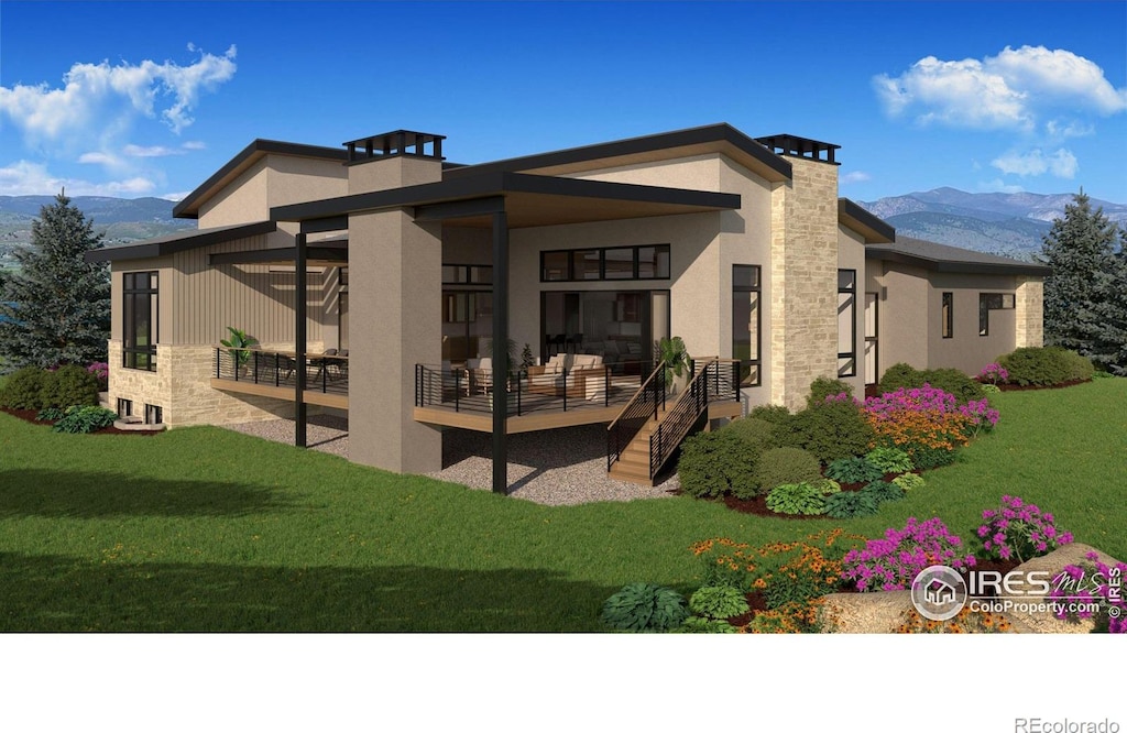 2669 Southwind Dr, Berthoud, CO 80513 - rear view of property with a mountain view, stucco siding, a patio, and stone siding