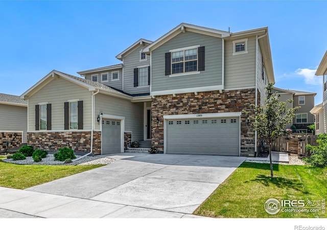 1389 Lyons Ln, Erie, CO 80516 - view of front of home with a garage, concrete driveway, stone siding, and a front lawn