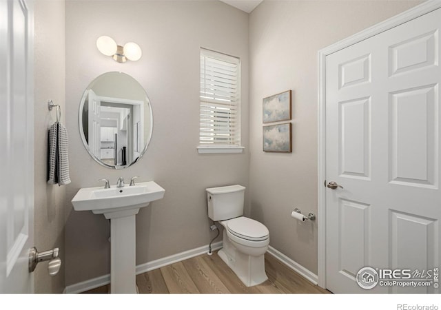 1389 Lyons Ln, Erie, CO 80516 - bathroom with wood finished floors and toilet