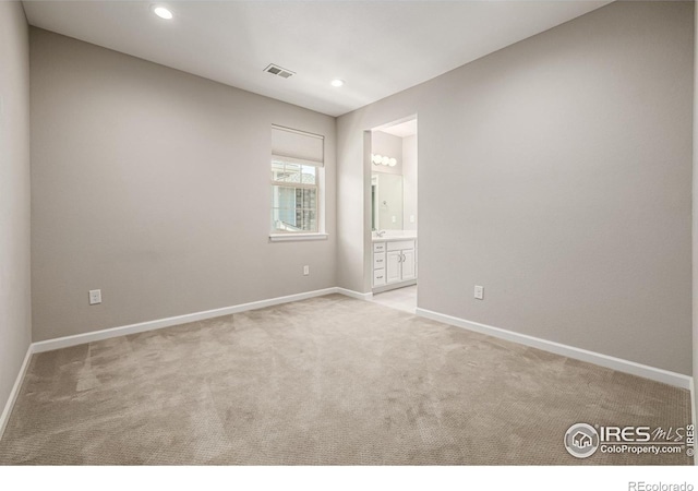1389 Lyons Ln, Erie, CO 80516 - empty room featuring light colored carpet and recessed lighting