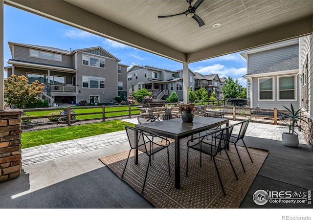 1389 Lyons Ln, Erie, CO 80516 - view of patio with a residential view, outdoor dining space, and ceiling fan