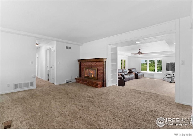 3400 Erving Ct, Berthoud, CO 80513 - carpeted living area with a brick fireplace and ceiling fan