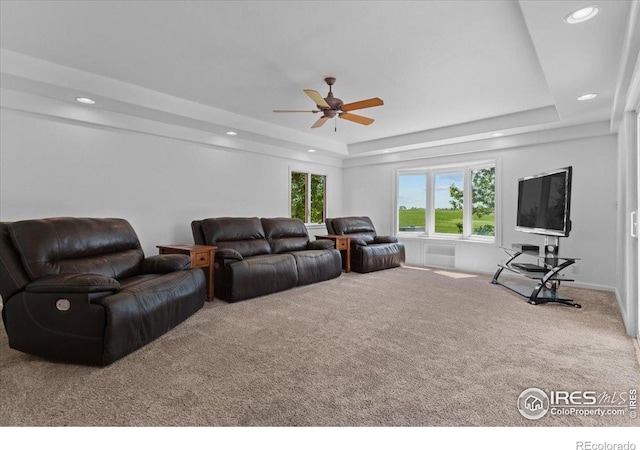 3400 Erving Ct, Berthoud, CO 80513 - carpeted living room featuring ceiling fan, a tray ceiling, and recessed lighting