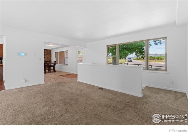 3400 Erving Ct, Berthoud, CO 80513 - unfurnished living room with carpet floors and baseboards