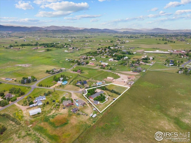 3400 Erving Ct, Berthoud, CO 80513 - aerial view of property and surrounding area featuring a mountainous background and property parcel outlined