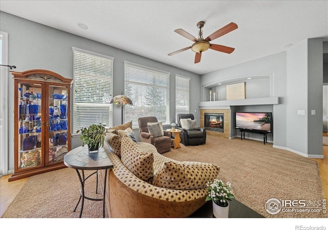 2707 Pochard Ct, Johnstown, CO 80534 - living room with a ceiling fan and a glass covered fireplace