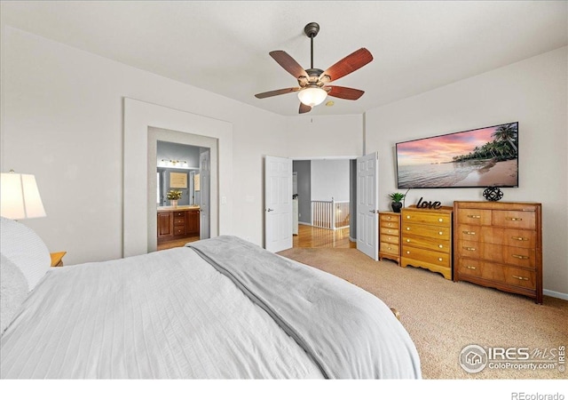 2707 Pochard Ct, Johnstown, CO 80534 - bedroom featuring ensuite bathroom, carpet floors, and a ceiling fan