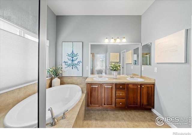 2707 Pochard Ct, Johnstown, CO 80534 - full bath featuring double vanity, a bath, and tile patterned flooring