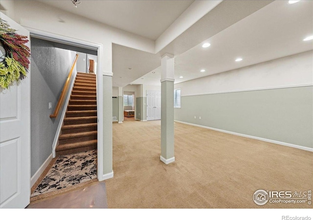 2707 Pochard Ct, Johnstown, CO 80534 - below grade area featuring light colored carpet, recessed lighting, and stairs