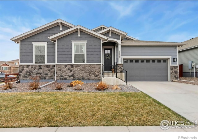2156 Setting Sun Dr, Windsor, CO 80550 - craftsman house with stone siding, a garage, and a front yard