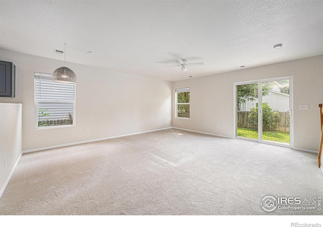 3314 Planter Way, Fort Collins, CO 80526 - carpeted empty room featuring a ceiling fan and a textured ceiling