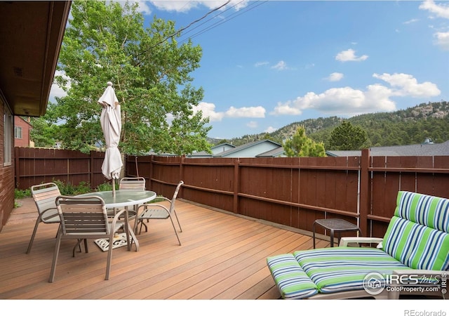 1795 Olympian Ln Unit A, Estes Park, CO 80517 - wooden deck with a fenced backyard and outdoor dining space