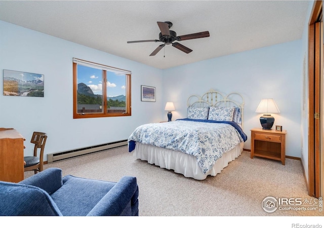 1795 Olympian Ln Unit A, Estes Park, CO 80517 - bedroom with a baseboard radiator, carpet, and ceiling fan