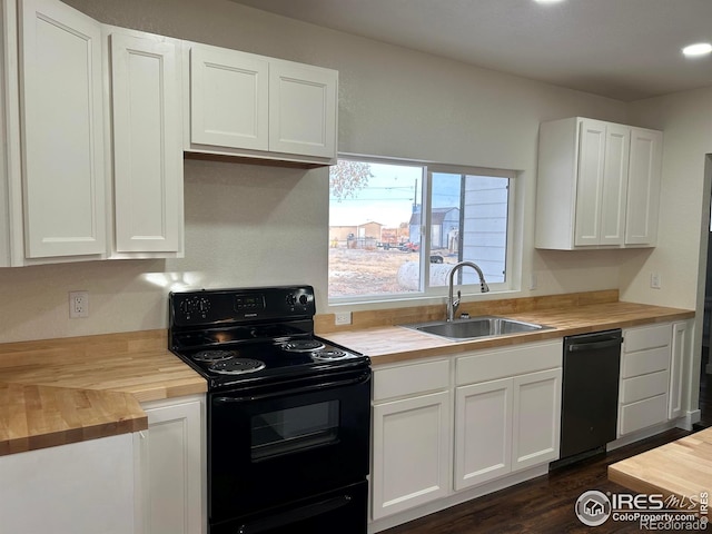 809 Warren St, Weldona, CO 80653 - kitchen with black range with electric cooktop, wood counters, dishwashing machine, white cabinetry, and dark wood finished floors