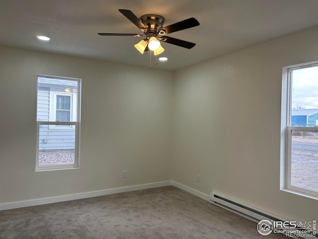 809 Warren St, Weldona, CO 80653 - carpeted spare room with baseboard heating, a ceiling fan, and recessed lighting