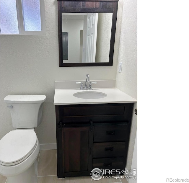 809 Warren St, Weldona, CO 80653 - half bathroom with vanity and toilet