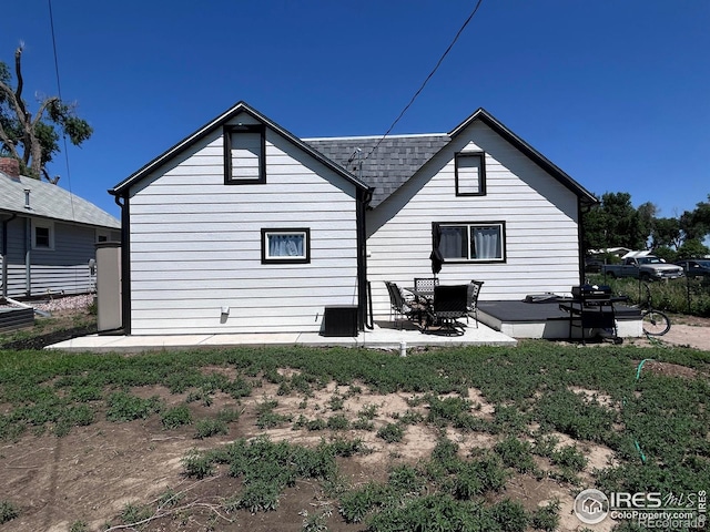 809 Warren St, Weldona, CO 80653 - rear view of property with a patio