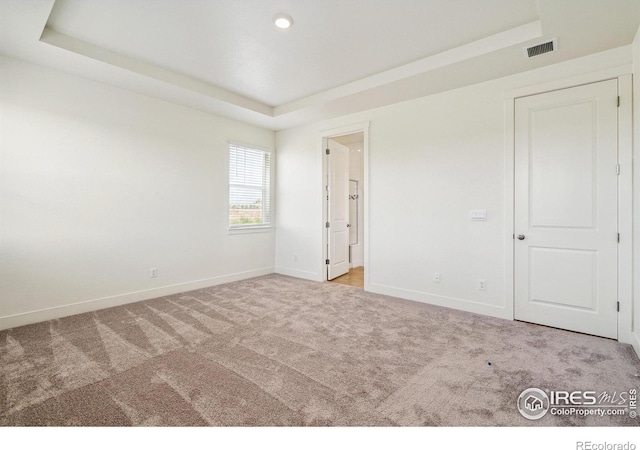 1842 Chaffee Crest Dr, Berthoud, CO 80513 - unfurnished bedroom featuring a tray ceiling, carpet, and recessed lighting
