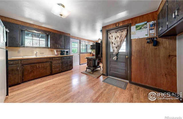 30 Falls Creek Dr, Bellvue, CO 80512 - kitchen with light countertops, dark brown cabinets, and wooden walls