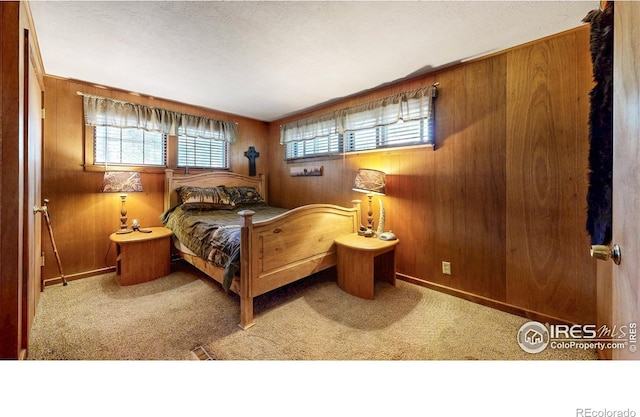 30 Falls Creek Dr, Bellvue, CO 80512 - bedroom with wood walls and carpet flooring