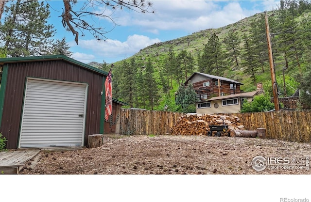 30 Falls Creek Dr, Bellvue, CO 80512 - garage featuring a mountain view